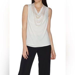 Brooke Shields Timeless sleeveless chiffon top with chain detail.